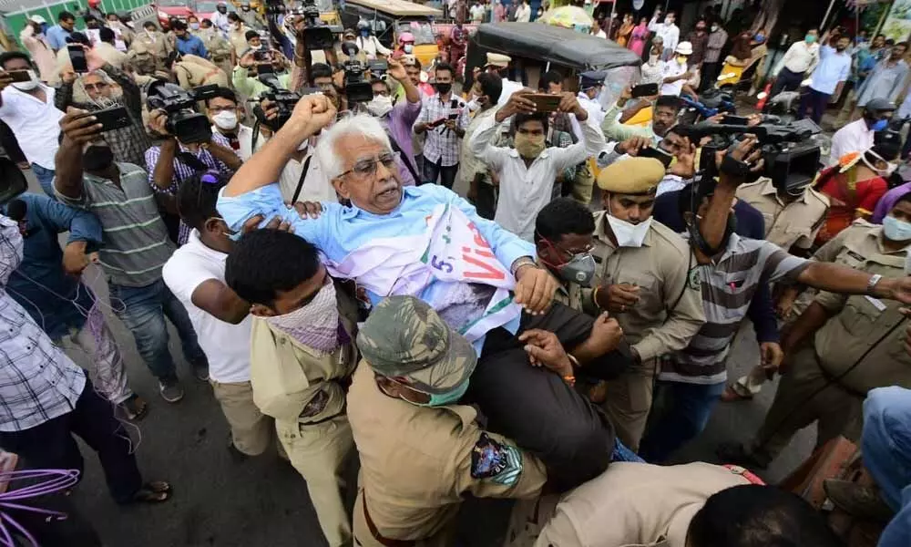 CITU AP state committee chief Ch Narasinga Rao being taken into custody by police at Gopalapatnam on Friday