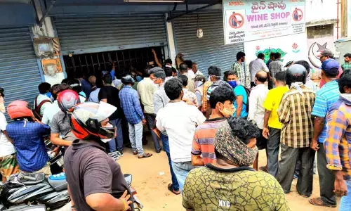 Unmindful of social distancing norms, tipplers continue to flock at a wine shop located at NAD in Visakhapatnam