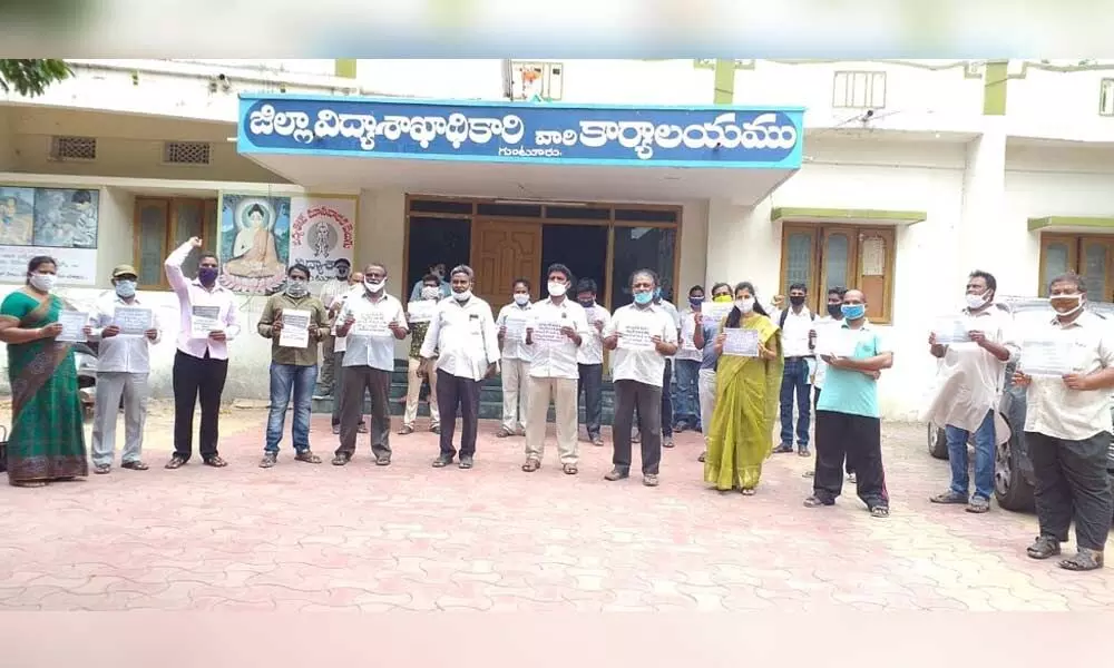 MLC KS Lakshmana Rao,  PTLPWA leaders protesting in front of DEO office in Guntur on Monday