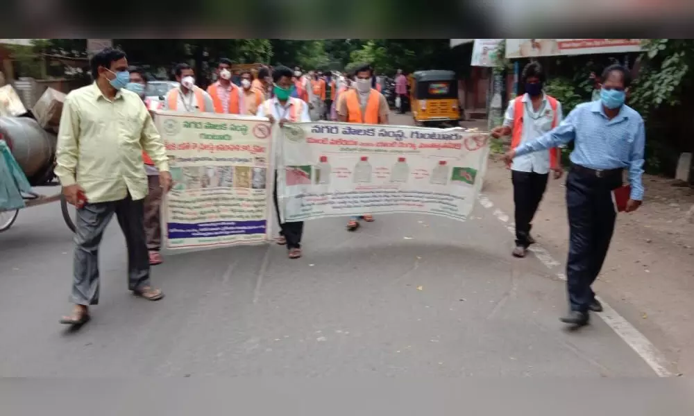 GMC Public Health Department officials taking out a rally in Guntur on Monday