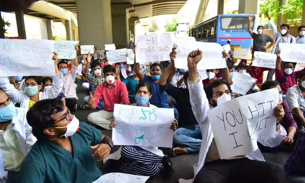 Doctors of Gandhi Hospital stage a protest against alleged manhandling in Hyderabad on Wednesday