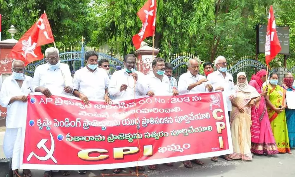 CPI leaders staging a protest before the Collectorate at Khammam on Wednesday