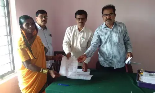 Officials issuing show-cause notice to Chinna Takkadapalli village sarpanch Devubai on Thursday