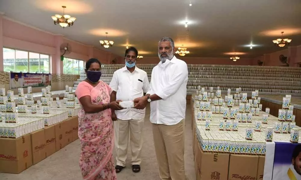 Government Whip and Chandragiri MLA Chevi Reddy Bhaskar Reddy distributing multivitamin syrup bottles in Chandragiri constituency on Thursday