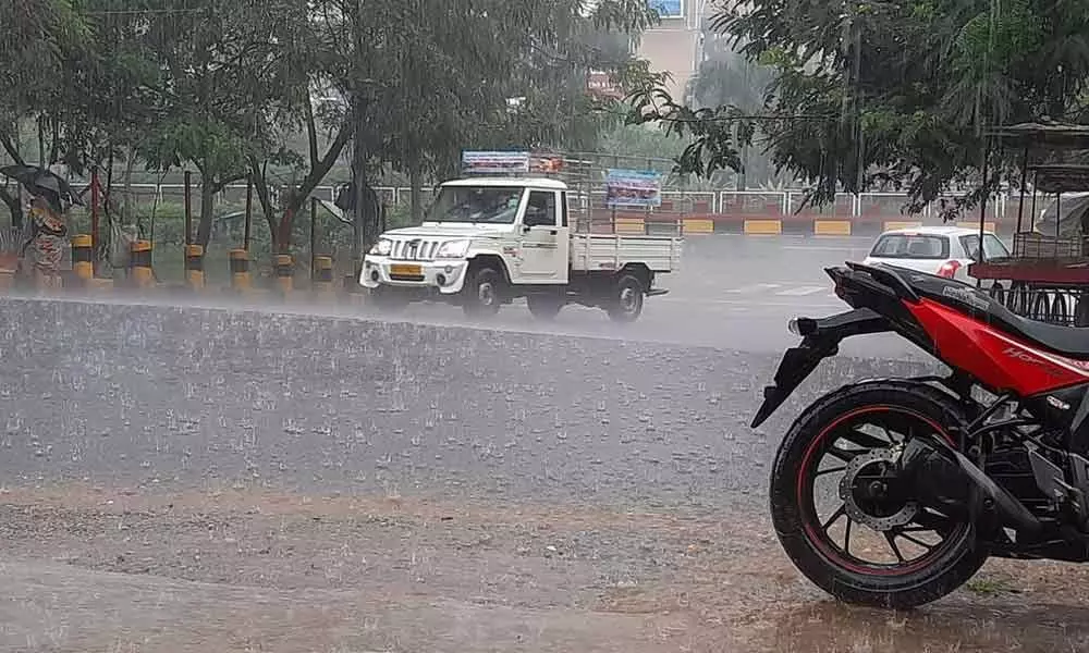 A vehicle wading through water on national highway in Visakhapatnam on Thursday  	Photo: Vasu Potnuru
