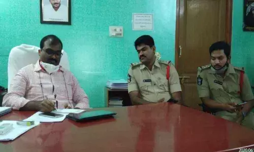 Municipal Commissioner C Obulesh addressing media persons in Chittoor on Friday, Two Town CI Yugandhar is also seen