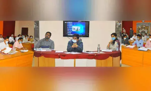 Collector R Muthyala Raju reviewing housing sites allotment with officials