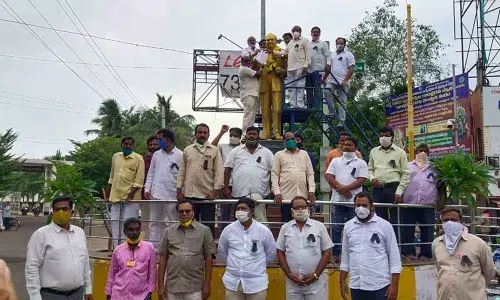 TDP leader K Naveen Kumar and others submitting a memorandum to Dr BR Ambedkar statue in Rajamahendravaram  on Friday