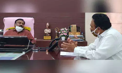 AP Madyavimochana Prachara Committee Chairman V Lakshman Reddy discussing with Prakasam district Collector Dr P Bhaskara in Ongole on Sunday