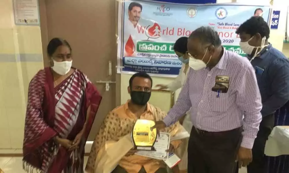 Blood donors being felicitated in Vijayawada on Sunday.