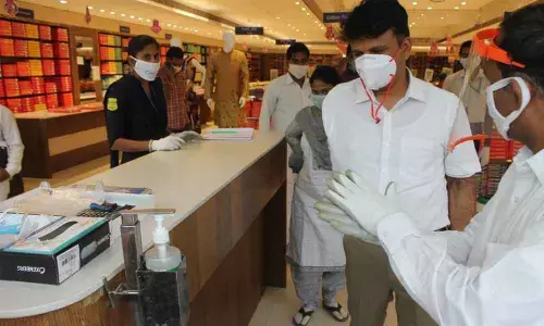 MCT Commissioner P S Girisha inspecting a shopping mall in Tirupati on Monday