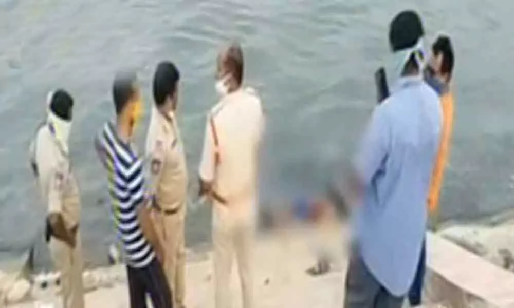 Suryapet: Woman throws two children into river after fight with husband