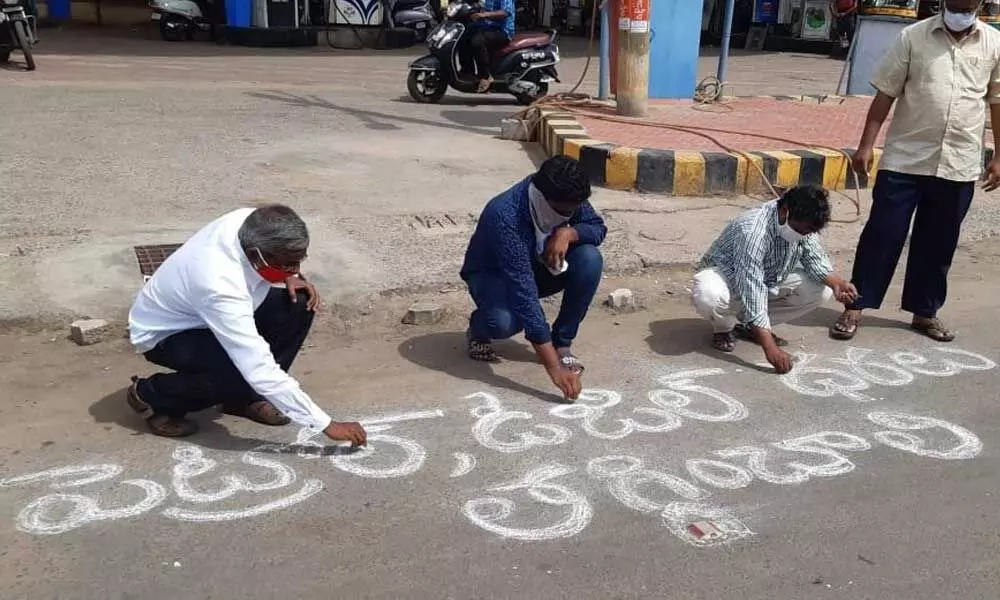 CPM leaders protesting against the hike in the prices of diesel and petrol in Vijayawada on Monday