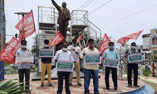 CPI activists protesting at Ambedkar Statue in Guntur on Tuesday CPI activists protesting at Ambedkar Statue in Guntur on Tuesday