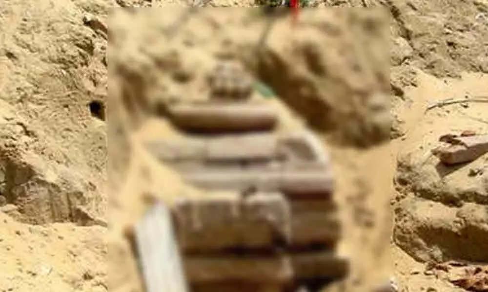 Buried temple surfaces during sand quarrying