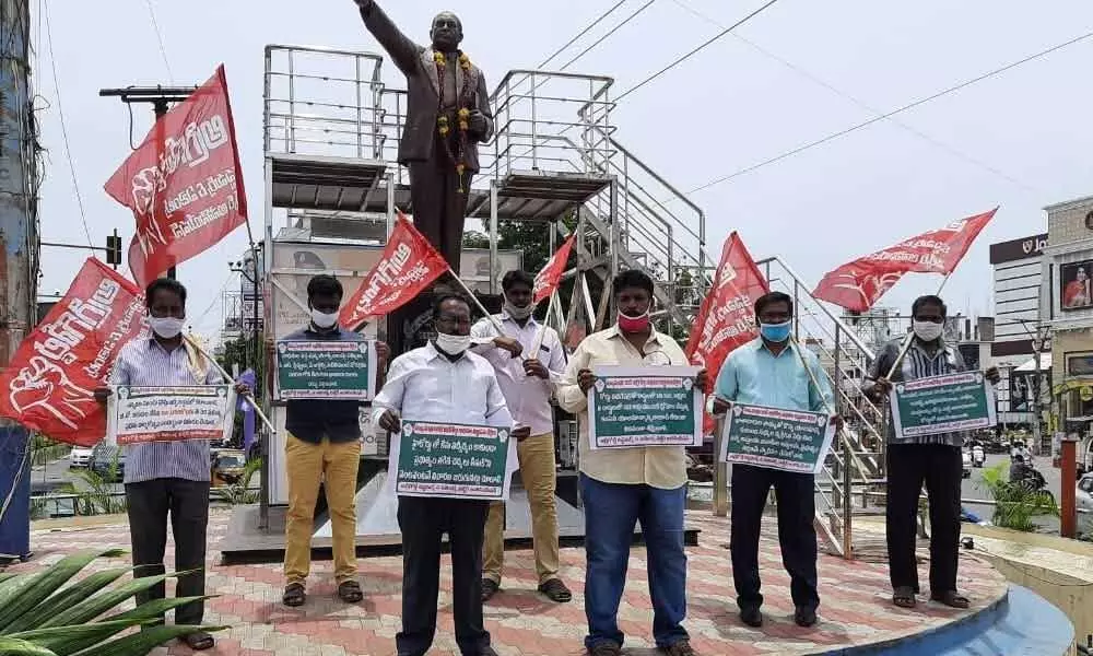 CPI activists protesting at Ambedkar Statue in Guntur on Tuesday