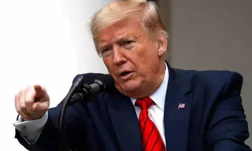 Trump signs sanctions law to punish China over human rights violations on Uighur Muslims