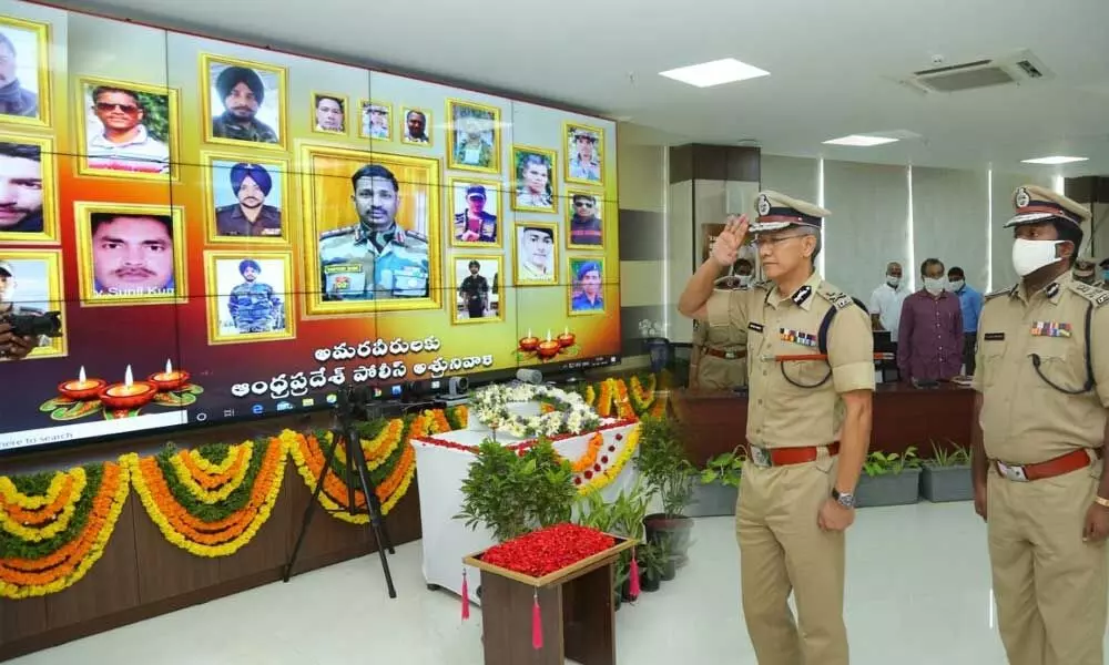 DGP D Gautam Sawang paying tributes to martyrs at the State police office in Mangalagiri on Thursday
