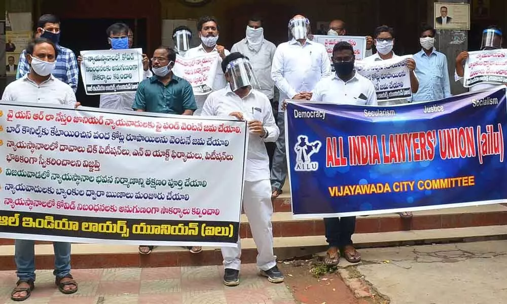 The lawyers affiliated to All India Lawyers Union staging a protest demonstration at the Civil Court Complex in Vijayawada on Thursday. 	Photo: Y Vinay Kumar