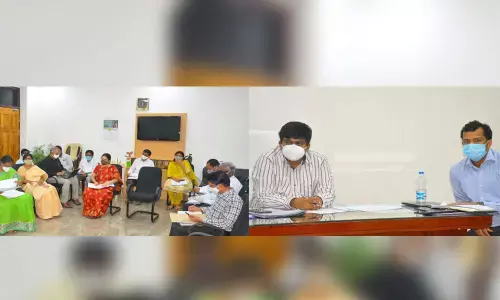 Collector R Muthyala Raju reviewing progress of works under Manabadi Nadu-Nedu programme with officials in Eluru