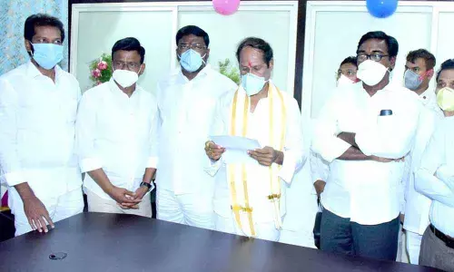 Bachu Vijay Kumar taking charge as SUDA Chairman in Khammam on Friday.  Minister for Transport Puvvada Ajay Kumar also seen