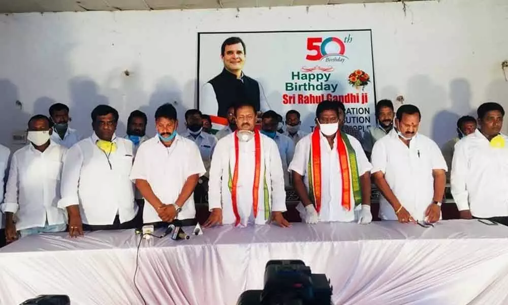 Former Minister and ex-Leader of Opposition in State Legislative Council Mohammed Ali Shabbir and other leaders observing two-minute silence in the honour of the martyrs of Galwan Valley, in Kamareddy on Friday