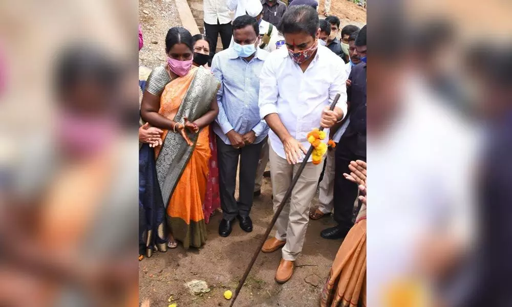 KT Rama Rao laying foundation stone for a developmental work in Gambhiraopet mandal on Friday