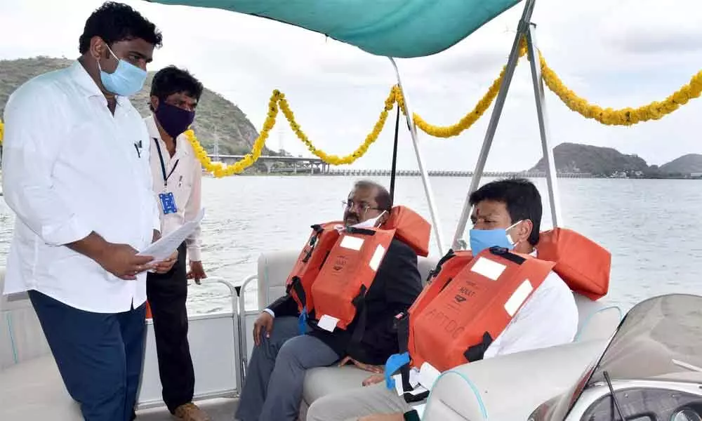 Collector A Md Imtiaz going on a boat ride in River Krishna after inauguration of the control rooms in Vijayawada on Friday