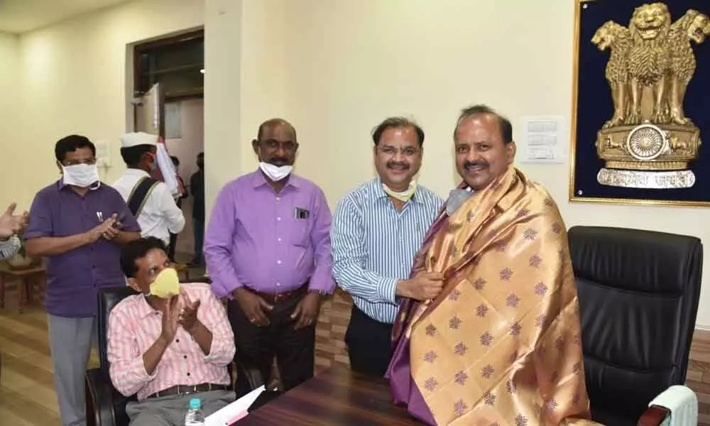 Collector M Hari Jawaharlal being felicitated by the officers in Vizianagaram on Saturday