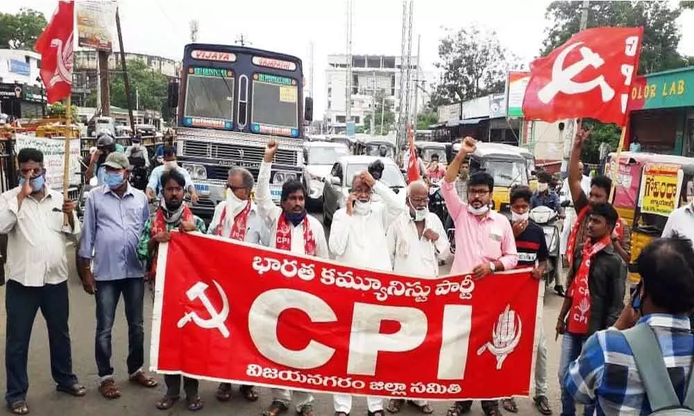 CPI leaders staging a protest against hike in prices of petroleum products, in Vizianagaram on Saturday