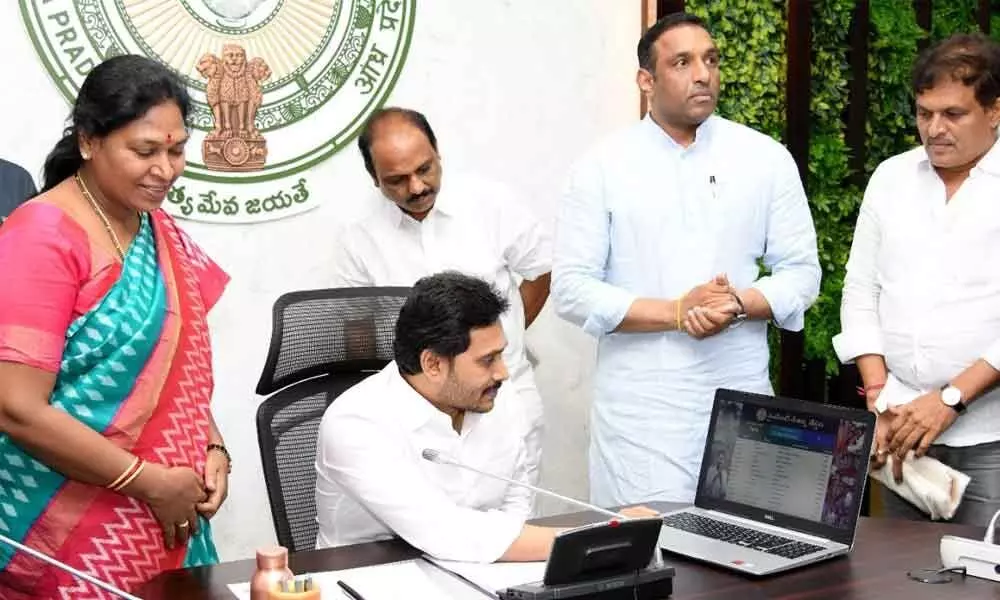 File picture of Chief Minister Y S Jagan Mohan Reddy releasing financial assistance of Rs 24,000 each to weavers in State
