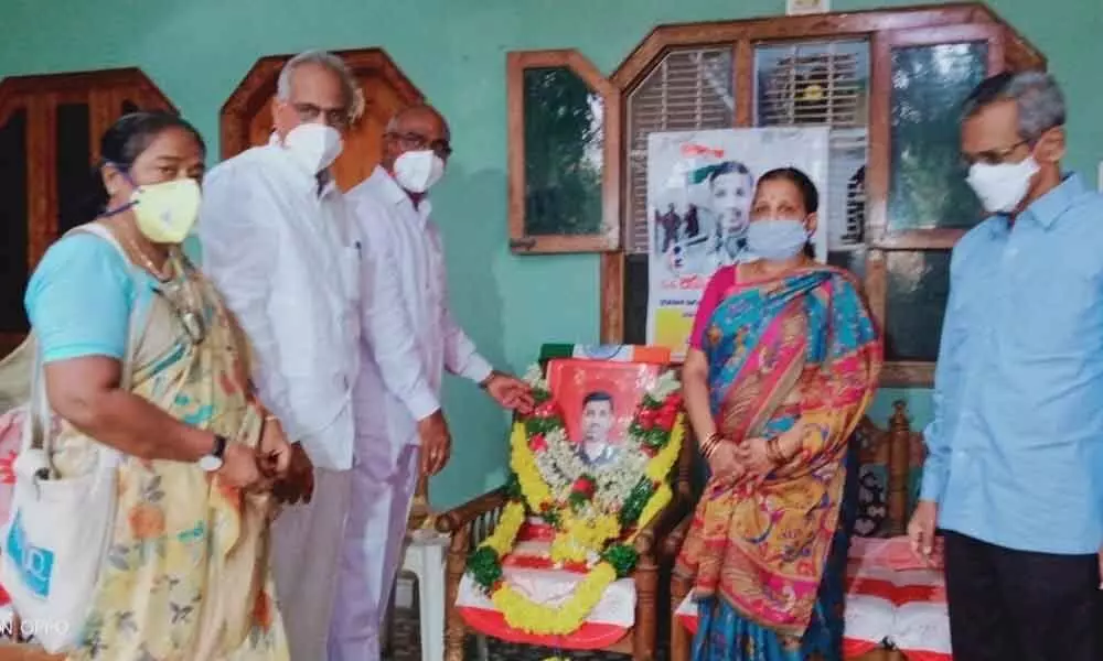 CPI State secretary Chada Venkat Reddy paying tributes to Colonel Santhosh Babu at his residence in Suryapet on Sunday