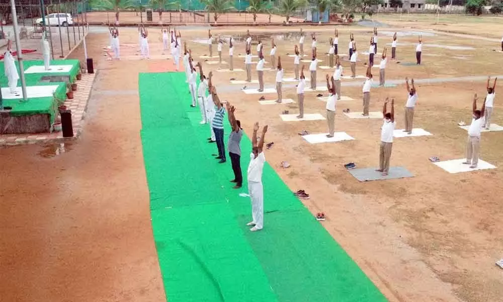 International Yoga day being celebrated at Police Parade Grounds by Urban police in Tirupati on Sunday