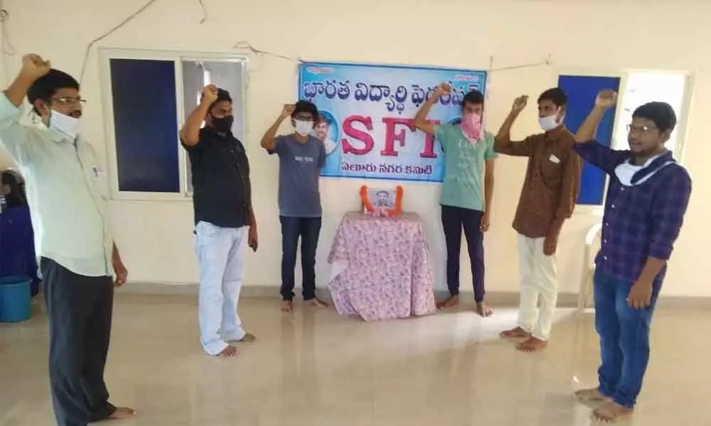 SFI and DYFI leaders paying tributes to martyrs in Eluru on Sunday