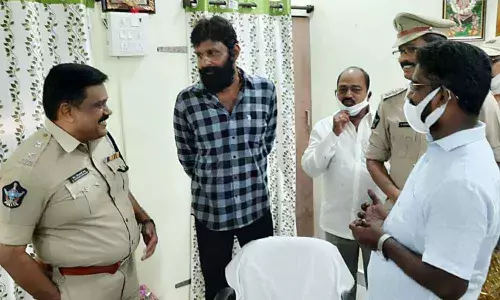 Civil Supplies Minister Kodali Venkateswara Rao and Krishna district Superintendent of Police M Ravindranath Babu share a word at the renovated police station in Gudivada on Monday