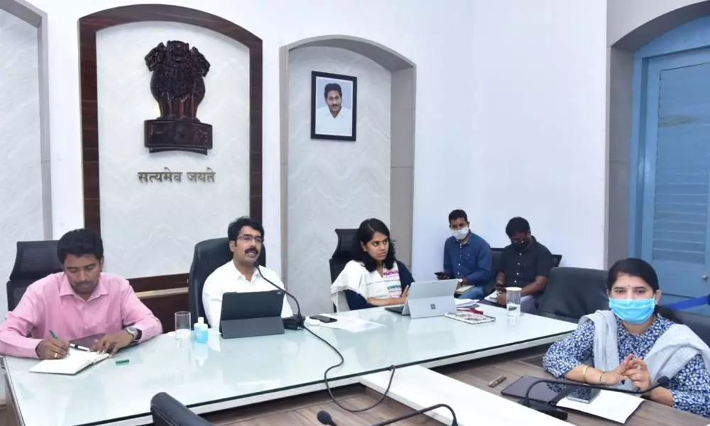 Collector  D Muralidhar Reddy addressing a video-conference with district officials at Collectorate in Kakinada on Monday