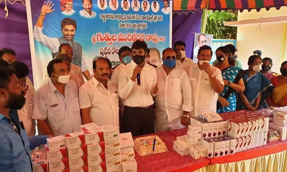 MP Margani Bharat Ram handing over medicines to government hospital superintendent Dr Rao