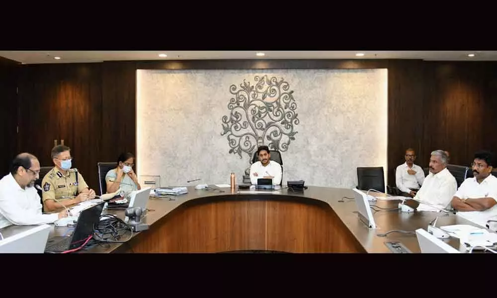 Chief Minister Y S Jagan Mohan Reddy taking part in a videoconference with District Collectors and SPs on Tuesday