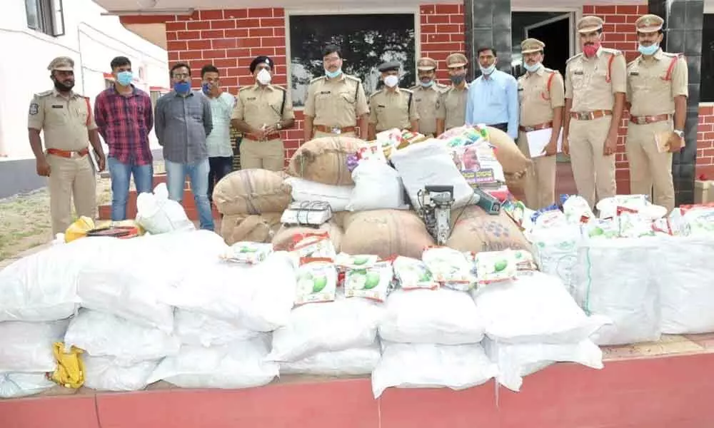 SP AV Ranganath showing spurious seeds seized from a gang in Nalgonda on Tuesday