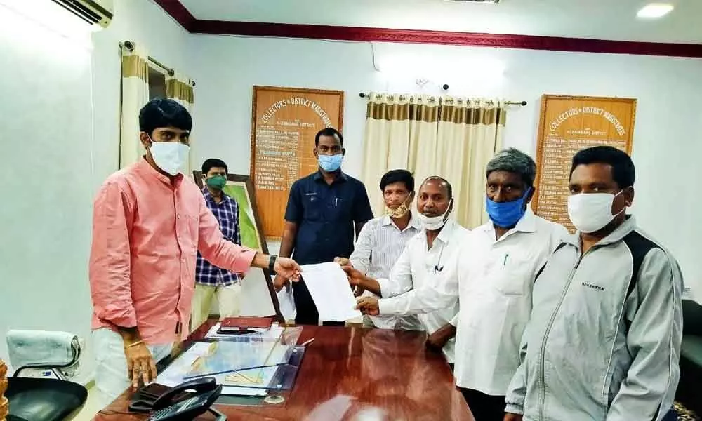 AIKMS leaders submitting a memorandum to District Collector C Narayana Reddy at his chamber in Nizamabad on Tuesday