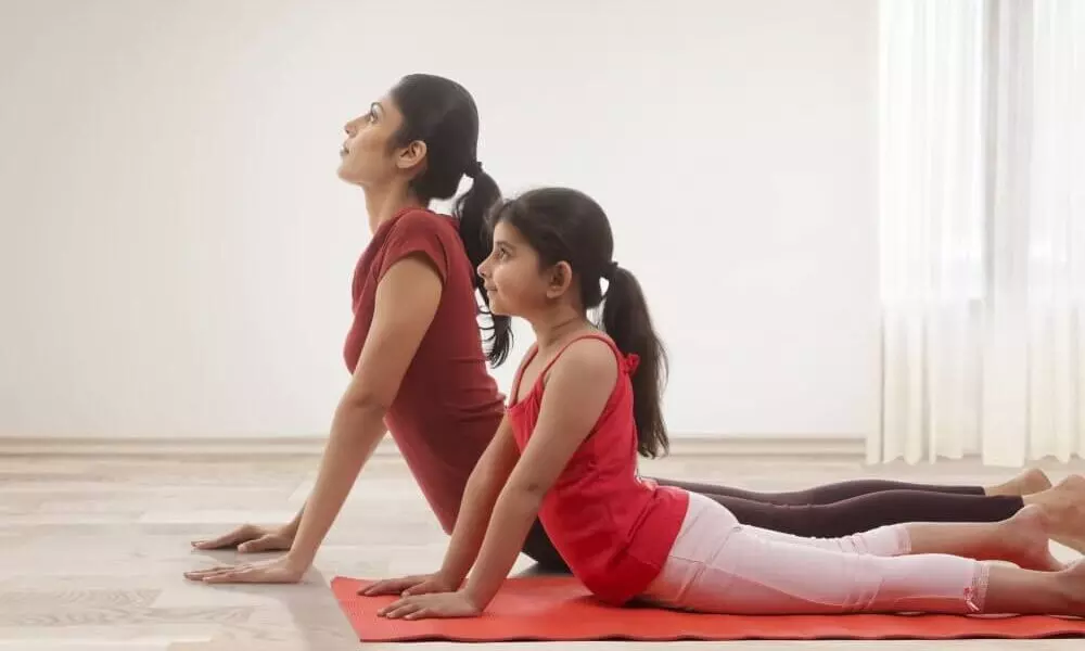 7 Yoga Poses That Help Boost Fertility - GENESIS Fertility & Reproductive  Medicine