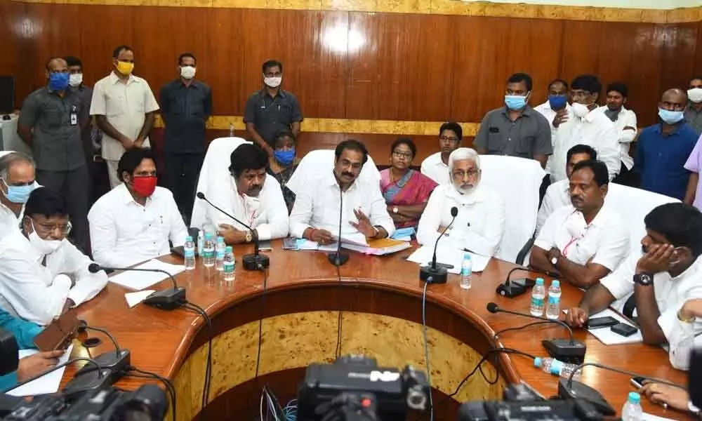 District in-charge Minister Kurasala Kannababu along with the officials concerned and MPs at a review meeting in Visakhapatnam on Wednesday.