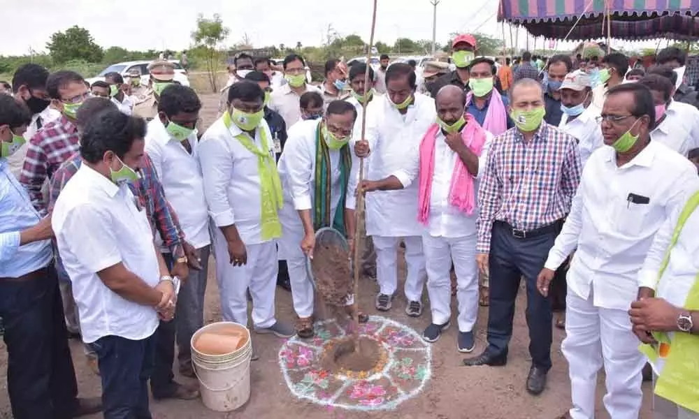 State Legislative Council Chairman Gutta Sukhender Reddy planting a sapling at Pamangundla village on Thursday as part of sixth phase of Haritha Haram drive. Council Deputy Chairman Nethi Vidya Sagar also seen