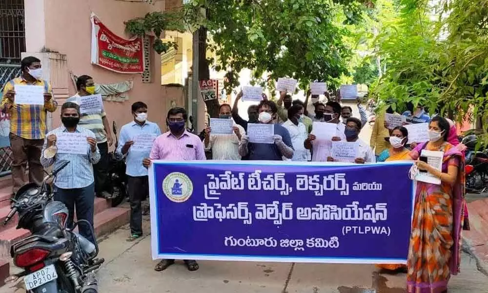 Teachers and lecturers under the banner of Teachers,Lecturers and Professors Welfare Association taking out a procession in Guntur on Thursday