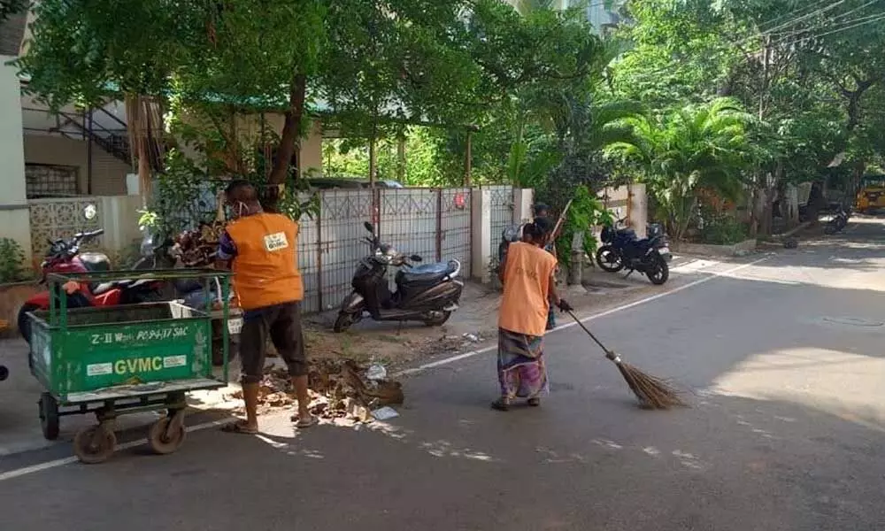 GVMC sanitation staff at work in Visakhapatnam on Thursday