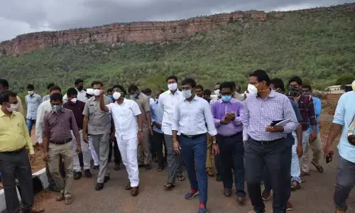 Education Minister A Suresh and others inspecting development works at Idupulapaya in Kadapa district on Friday