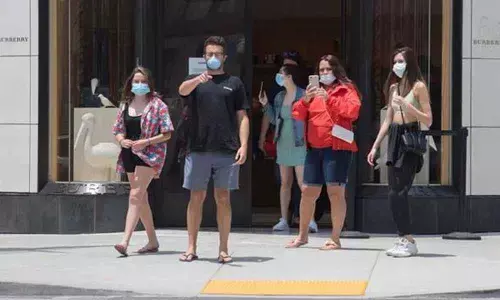 As US reopens, cases hit new high