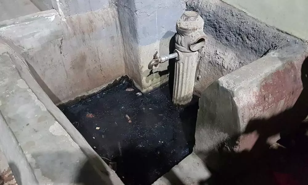 Sorry state of public taps in slums