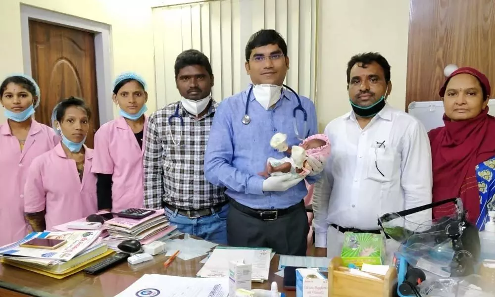 Dr Kumar Varma along with the infant and parents