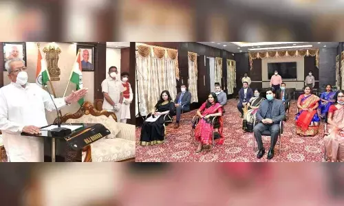 Governor Biswa Bhusan Harichandan interacting with trainee IAS officers at Raj Bhavan in Vijayawada on Monday